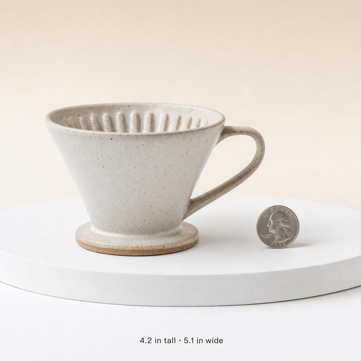 AI-generated Etsy scale-reference podium shot of a single product against a clean minimalist backdrop with a size reference, the slot-3 scale shot prompt in the same sub-4.1 family.